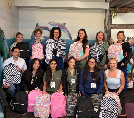Glassrock pediatrics team showing the backpacks they donated